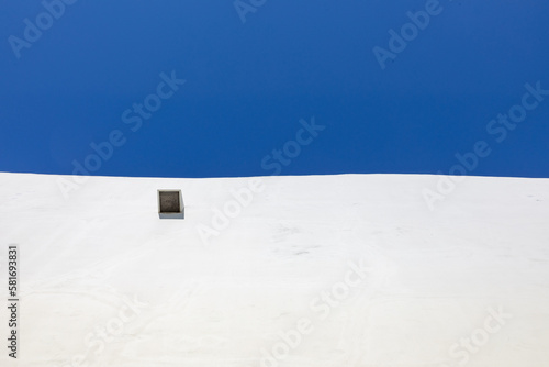 background of white wall with blue sky as harmonic composition
