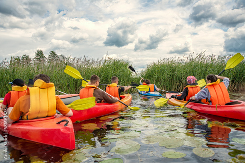 canoeing on the lake among cattails of water lilies and reeds