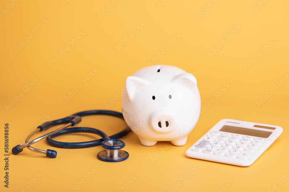 custom made wallpaper toronto digitalFinancial for health concept, The idea of ​​saving money for healthcare, Close up stethoscope and white piggy bank on yellow color copy space. Health and finance concept