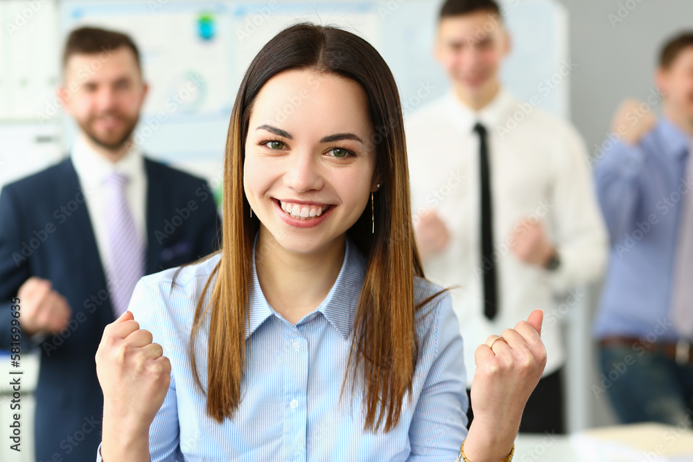 Portrait of smiling successful businesswoman and team Portrait of smiling successful businesswoman and team