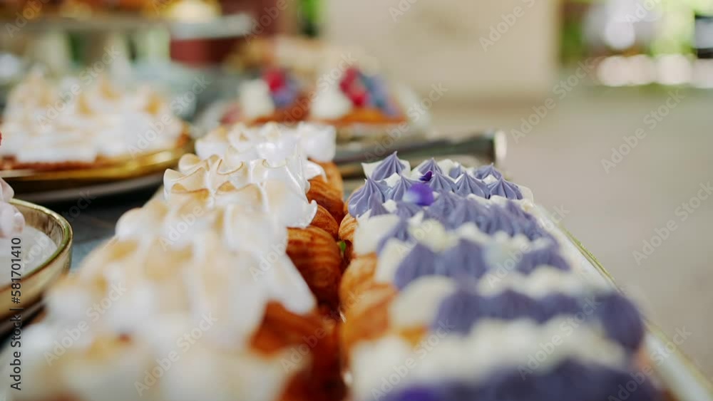 Pastries with cream, dessert table display close up Pastries with cream, dessert table display close up
