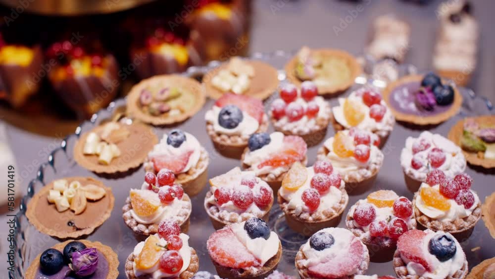 Fruit cream tarts and pastries on dessert plate, push out Fruit cream tarts and pastries on dessert plate, push out