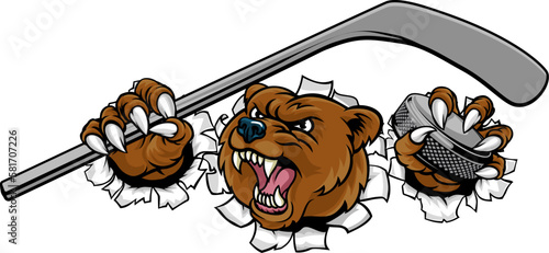 A bear ice hockey player animal sports mascot holding a hockey stick and puck