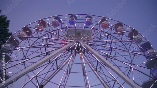 Low Angle Of Ferris Wheel In The Evening