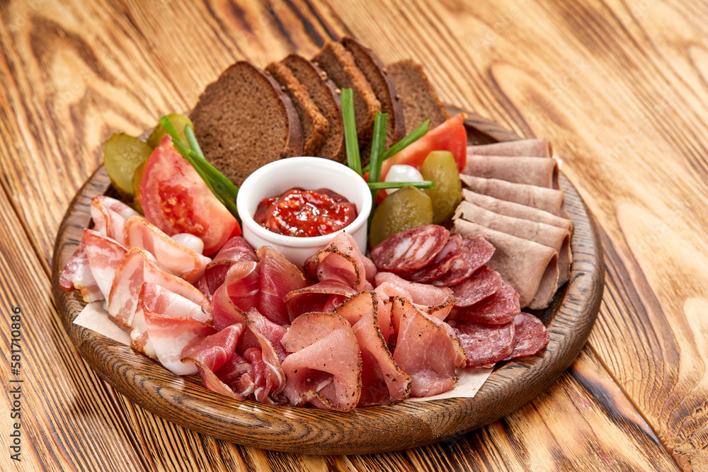 meat appetizer on the wooden background