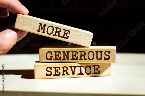 Wooden blocks with words 'More generous service'.