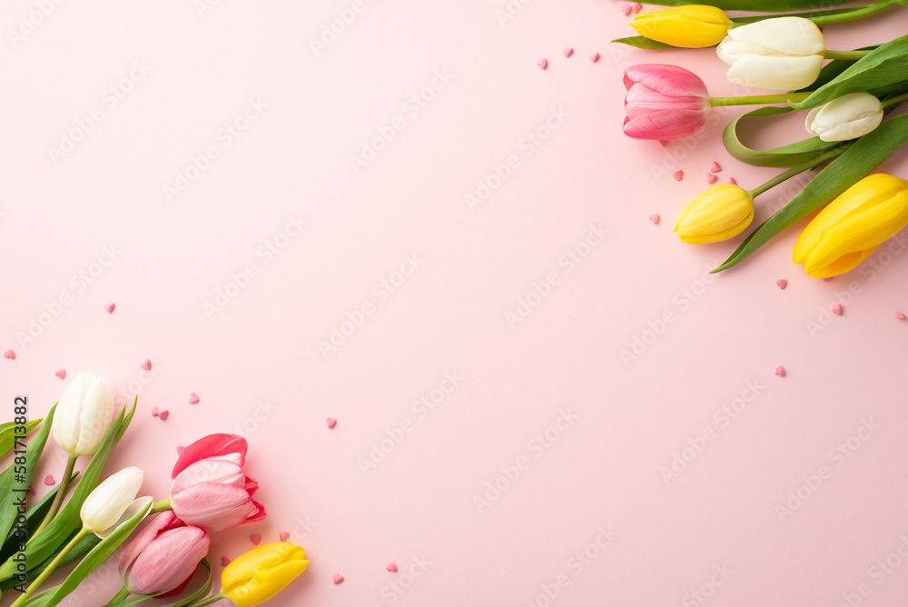 Spring holidays concept. Top view photo of yellow white pink tulips and sprinkles on isolated light pink background with copyspace - obrazy, fototapety, plakaty 