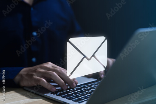 Businessman sending a letter from a laptop. electronic mail concept is online communication on the Internet network Receiving 