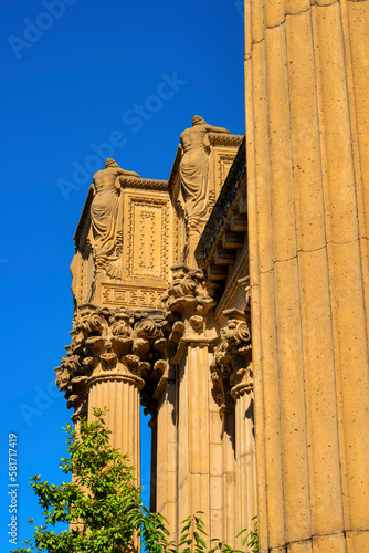 Ancient colosieum or temple in the old world with roman style design in late afternoon sun with orange clay color photo