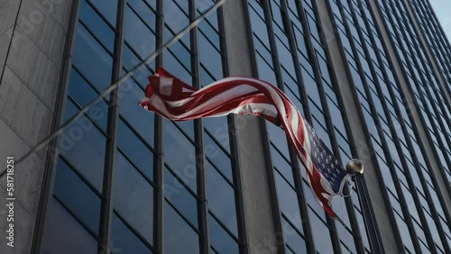 American flag waving on the building in New York, Financial district slow motion