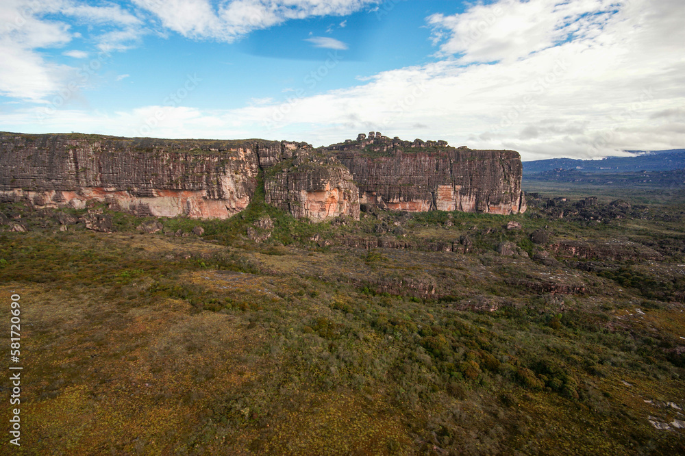 Sandstone rock cliffs on the plateau of Auyan tepui, table mountain in Venezuela Sandstone rock cliffs on the plateau of Auyan tepui, table mountain in Venezuela