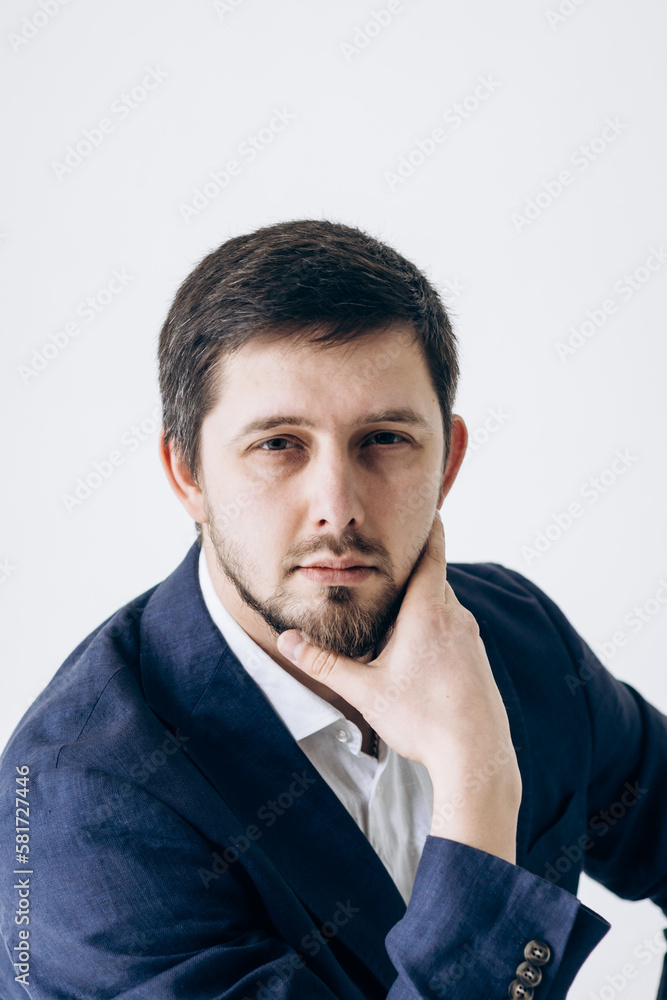 Portrait of a man in a business suit and white shirt