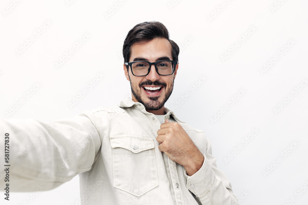 Closeup portrait man takes selfie with glasses smile with teeth joy on white isolated background, fashionable clothing style, copy space, space for text Closeup portrait man takes selfie with glasses smile with teeth joy on white isolated background, fashionable clothing style, copy space, space for text