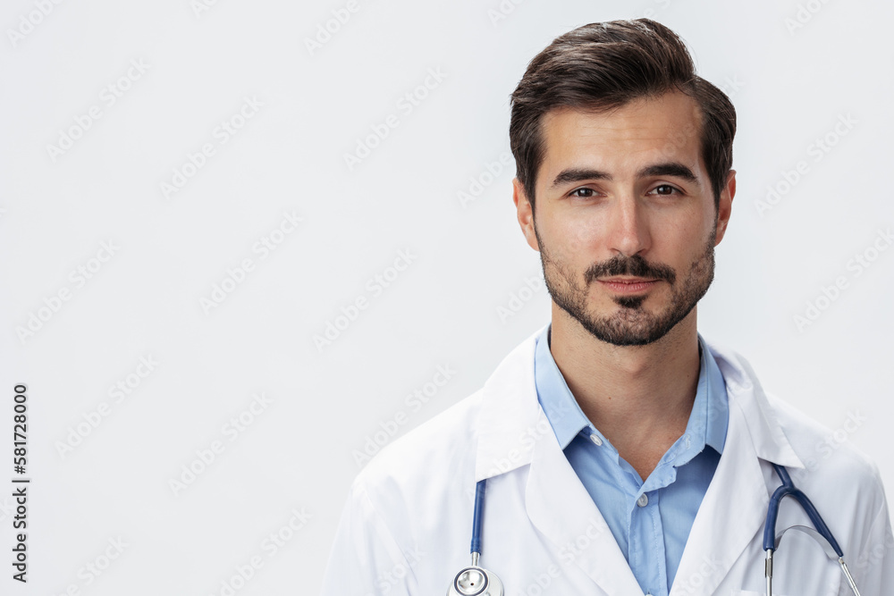 Man doctor in white coat with stethoscope and eyeglasses on white isolated background looking into camera, copy space, space for text, health Man doctor in white coat with stethoscope and eyeglasses on white isolated background looking into camera, copy space, space for text, health
