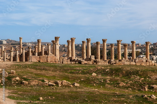 Jordan. Cathedral of St. Theodore. There are many antique columns in front of cathedral and around it. Gerasa (Jerash) is ancient city that is six and half thousand years old.