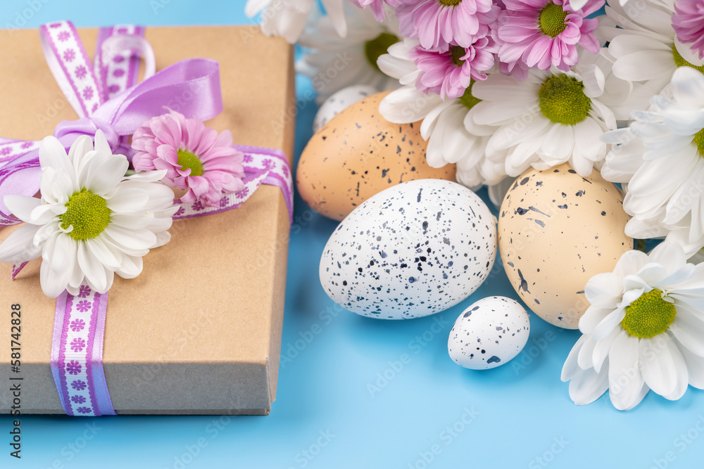 Gift box, Easter eggs and flowers