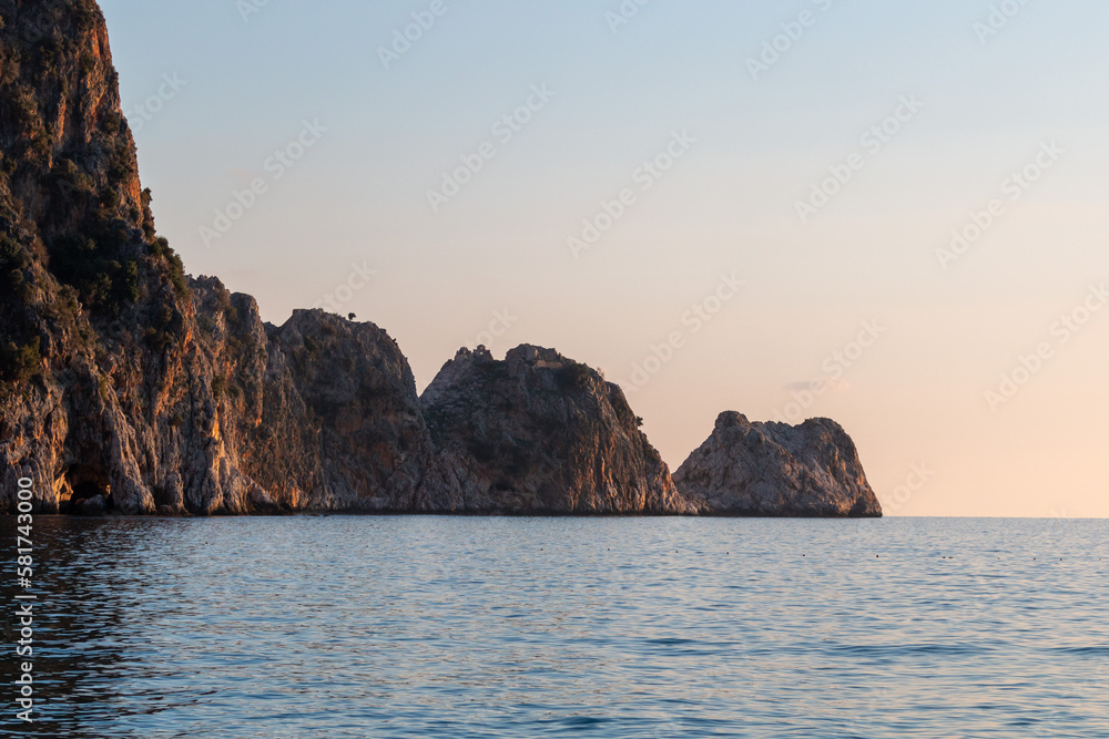 View of the rocks and the sea during sunset in Alanya