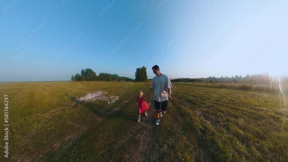 Dad and daughter are walking in the field, father and daughter are having fun in nature, daughter and father are walking in nature, shooting on a 360 camera Dad and daughter are walking in the field, father and daughter are having fun in nature, daughter and father are walking in nature, shooting on a 360 camera