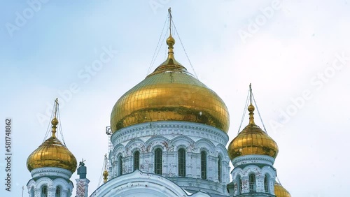 Belogorsky St. Nicholas Orthodox Missionary Monastery. Russia, Perm Krai, Belaya Gora. The temple on the hill in winter. Monastery on the background of snow. 4K photo