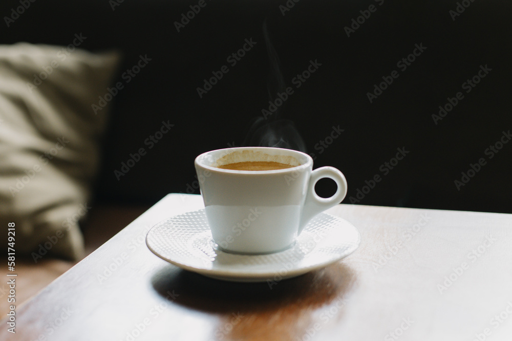 Cup of black coffee on a table in a cafe. Cup of black coffee on a table in a cafe.