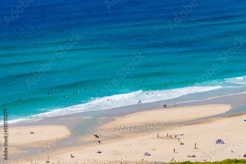 Sennen Cove beach and Cape Cornwall, beautiful bay with crystal clear turquoise water. Popular spot for surfing. England, UK.