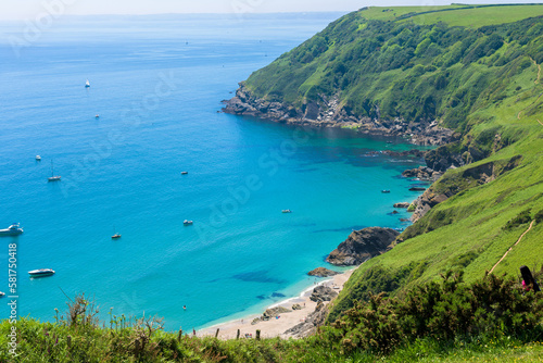 Stunning coastline and beach at Lantic Bay. Crystal clear turquoise sea water in Cornwall, England. photo