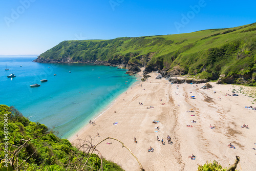 Stunning coastline and beach at Lantic Bay. Crystal clear turquoise sea water in Cornwall, England. photo