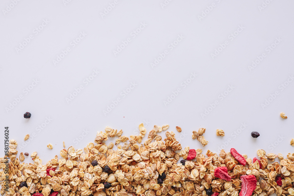 Granola close-up on a white background, space for text Granola close-up on a white background, space for text