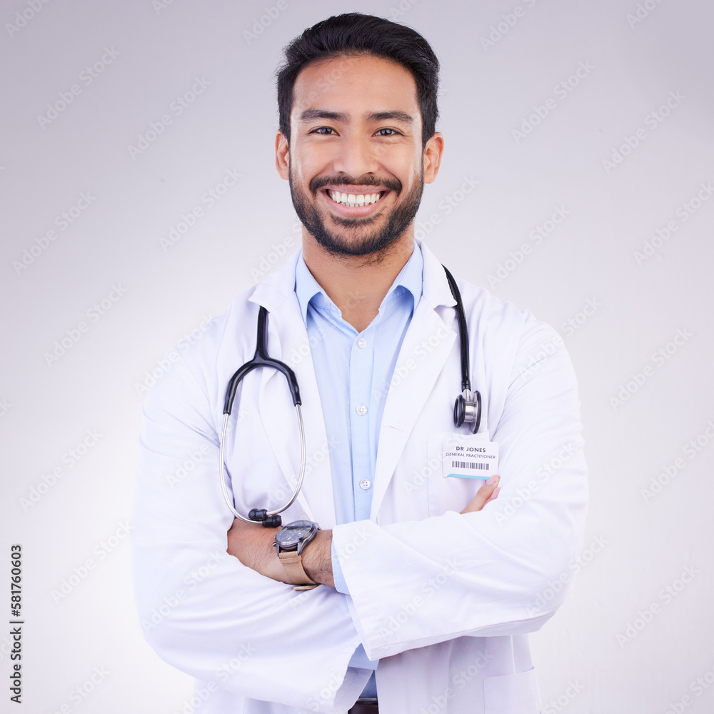 Doctor, man with arms crossed in portrait and smile, health and medical professional on studio background. Male physician, cardiovascular surgeon with stethoscope, happiness in medicine and mockup Doctor, man with arms crossed in portrait and smile, health and medical professional on studio background. Male physician, cardiovascular surgeon with stethoscope, happiness in medicine and mockup