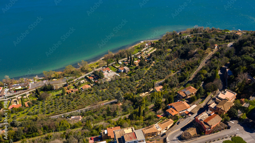 Aerial view of Lake Albano, a small volcanic crater lake in the Alban Hills of Lazio, near Rome, Italy. Castel Gandolfo, overlooking the lake, is the site of the Papal Palace of Castel Gandolfo.