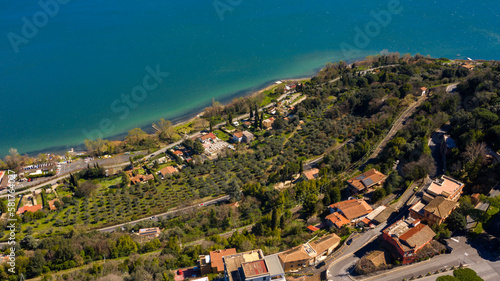 Fototapeta Naklejka Na Ścianę i Meble -  Aerial view of Lake Albano, a small volcanic crater lake in the Alban Hills of Lazio, near Rome, Italy. Castel Gandolfo, overlooking the lake, is the site of the Papal Palace of Castel Gandolfo.