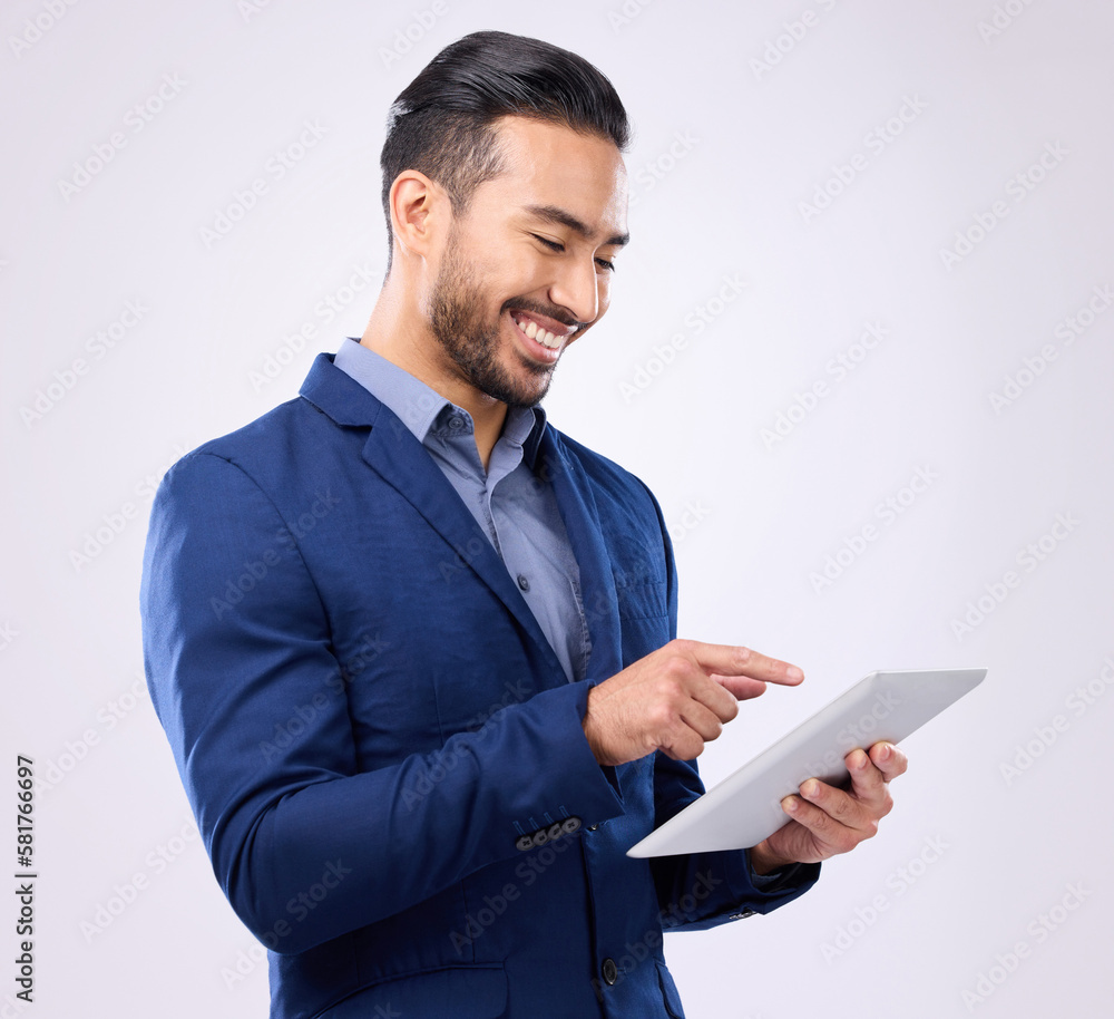 Man, business and tablet with a smile in studio for communication and network connection. Asian male model isolated on a gray background with tech for mobile app, online chat and search on internet Man, business and tablet with a smile in studio for communication and network connection. Asian male model isolated on a gray background with tech for mobile app, online chat and search on internet