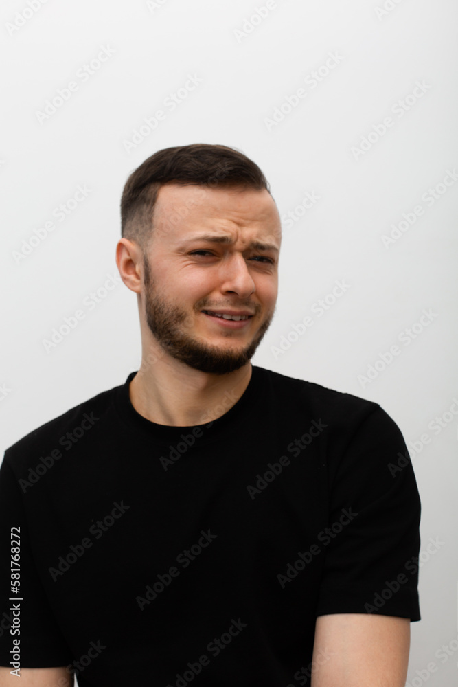 young man expressing regretful emotions young man expressing regretful emotions