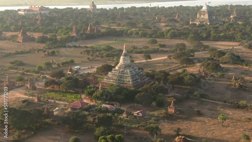 Drone dolley shot of the SuTaungPyae Pagoda during a sunrise in Myanmar. photo