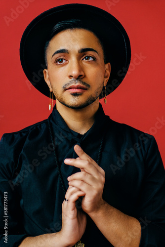 Close-up trans male with black hat