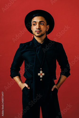 Confident trans masculine wearing black fashion outfit