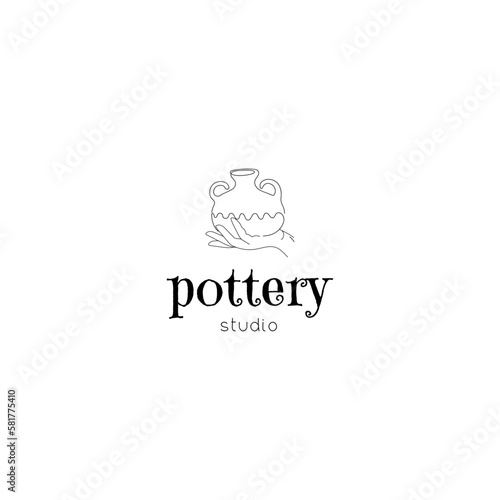 Pottery Studio Logo. Hand drawn pot on the hand on the white background.