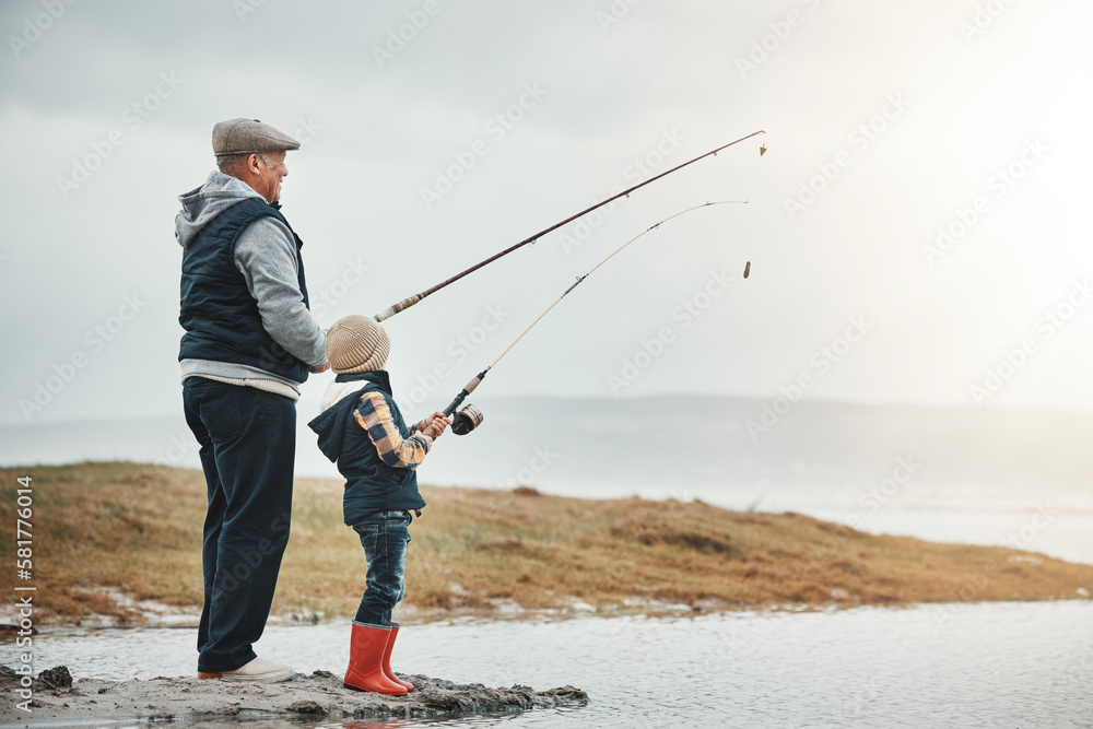 Lake, travel and grandfather fishing with a kid while on a adventure, holiday or weekend trip. Hobby, outdoor and elderly man teaching a child to catch fish in nature while on vacation in countryside Lake, travel and grandfather fishing with a kid while on a adventure, holiday or weekend trip. Hobby, outdoor and elderly man teaching a child to catch fish in nature while on vacation in countryside