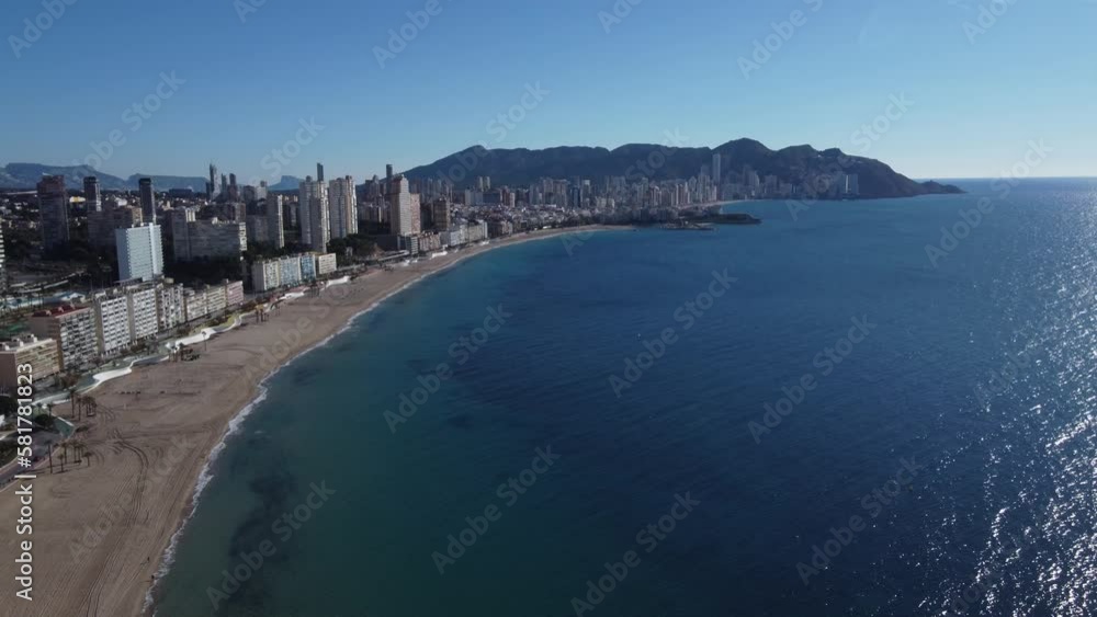aerial view over the bay with the Levante beach and the overall cityscape of Benidorm on the Mediterranean Sea in the Spanish province of Alicante. aerial view over the bay with the Levante beach and the overall cityscape of Benidorm on the Mediterranean Sea in the Spanish province of Alicante.