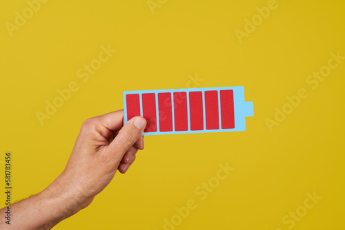 man with a depiction of a fully charged battery