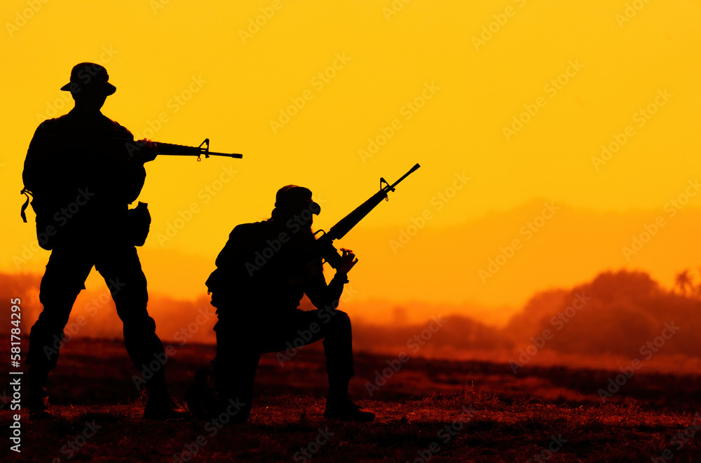 silhouette of soldier with rifle.soldiers in the uniform.soldier in action. silhouette of soldier with rifle.soldiers in the uniform.soldier in action.