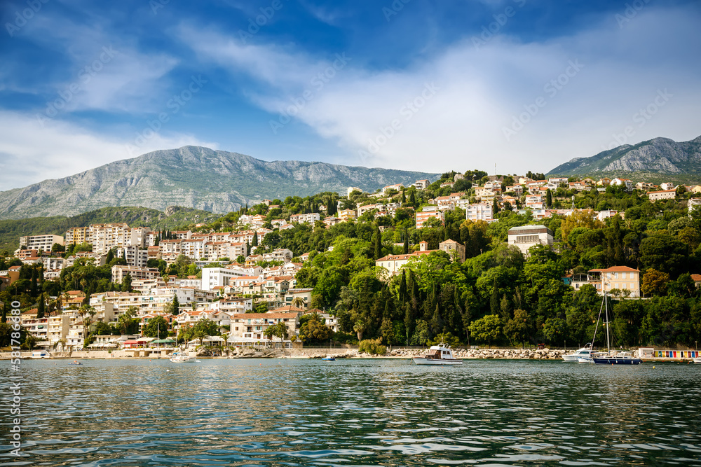 Cozy small white houses of Herceg Novi town from water, Montenegro
