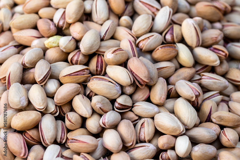 Pistachios texture and background. Roasted and salted pistachios in shell (texture, background). Pistachios texture and background. Roasted and salted pistachios in shell (texture, background).