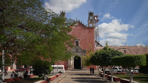 Slow push in to the San Juan Bautista Church In Motul Yucatan Mexico photo