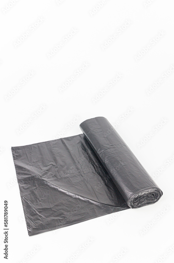Black plastic garbage bags isolated on white background, clipping path included. Black plastic garbage bags isolated on white background, clipping path included.