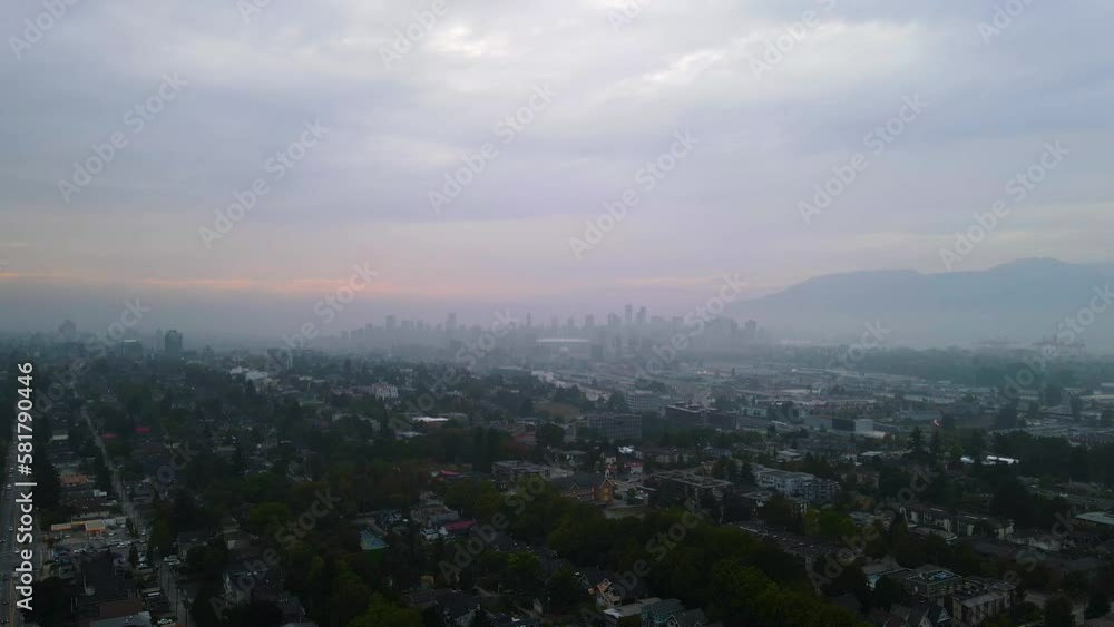 Downtown Vancouver City Skyline, Establishing Aerial on Hazy Evening Sunset Downtown Vancouver City Skyline, Establishing Aerial on Hazy Evening Sunset