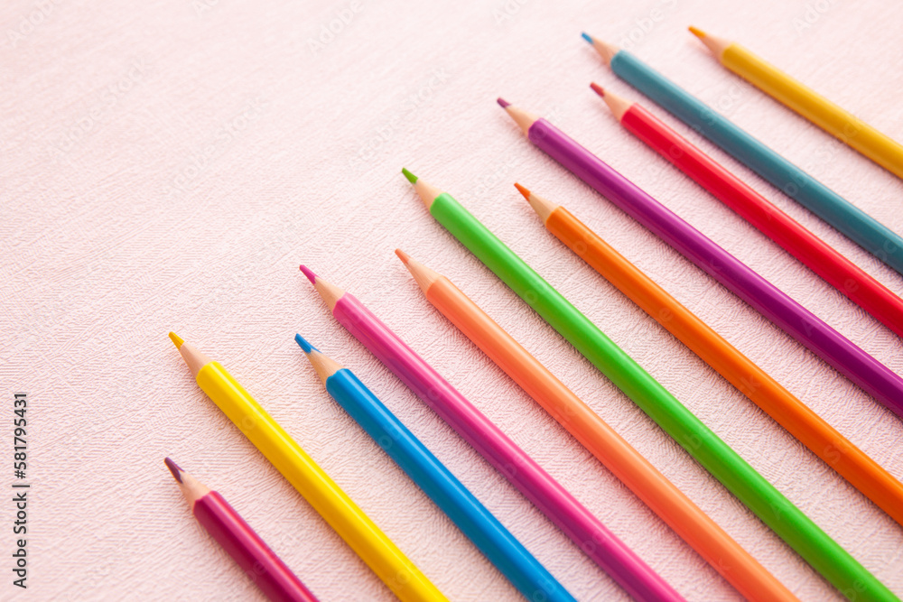 Pencils on pink background, art card with school stationery Pencils on pink background, art card with school stationery