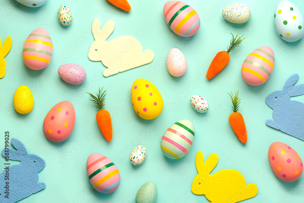 Happy Easter. Composition with colorful easter eggs,easter bunnies and carrots