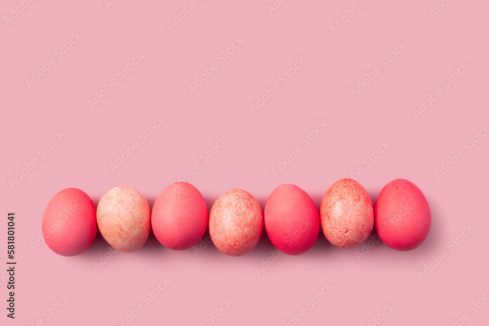 Easter card with colorful eggs on a pink background Easter card with colorful eggs on a pink background