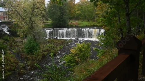 Waterfall with roaring and foaming water in Keila Joa park in autumn.